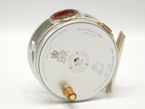 A fine Hardy Diamond Jubilee 1952-2012 Commemorative Hardy Perfect 3 ¼" wide drummed light salmon/trout fly reel, left hand wind model with ivorine handle, brass foot, red agate line guide, brass strapped tension screw and 1912 style check mechanism, drum