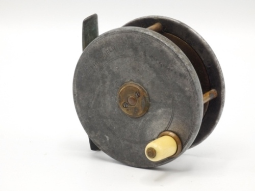 A scarce Hardy Field 2 7/8" trout fly reel, ivorine handle, brass bridge foot, triple cage pillars, brass drum, lipped faceplate with raised brass two screw spindle boss and stamped model name, wear from normal use, circa 1896 (see illustration)
