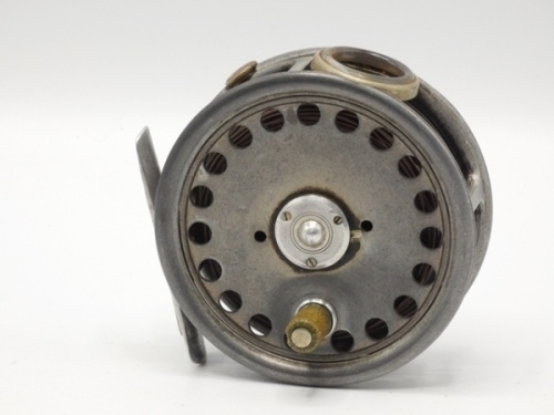 A rare Hardy St George 3 3/8" silent check trout fly reel and block leather case, xylonite handle, alloy foot, white agate line guide (two fine hairline cracks), three screw drum latch, milled rim tension screw and silent pressure pad check mechanism, we