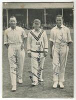 ‘The Century Makers’. 1928. Official mono printed newspaper picture, laid down to card, of Hobbs, Hendren and Sutcliffe walking off the pitch at Kennington Oval after they had each completed centuries, scoring a total of 463 out of 603 for 8 for ‘The Rest