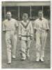 ‘The Century Makers’. 1928. Official mono printed newspaper picture, laid down to card, of Hobbs, Hendren and Sutcliffe walking off the pitch at Kennington Oval after they had each completed centuries, scoring a total of 463 out of 603 for 8 for ‘The Rest