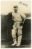 J.B. Hobbs, Surrey & England 1905-1934. Mono real photograph postcard of Hobbs standing full length at the crease, leaning on his bat. Nicely signed in blue ink to the lighter part of the photograph by Hobbs. VG