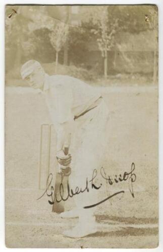 Gilbert Laird Jessop, Gloucestershire & England 1894-1914. Sepia real photograph postcard of Jessop, full length, in batting pose wearing a striped cap and gazing into the camera. The postcard nicely signed to image in black ink by Jessop. E. Hawkins & Co