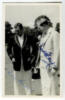 Australian tour of England 1961. Mono plainback postcard showing Australian Captain, Richie Benaud and Cambridge Captain, David Kirby, both in blazers inspecting the wicket at Fenners on the 17th May 1961, prior to the match. Signed in ink by both Captain