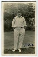 George Rubens Cox. Sussex 1895-1928. Mono real photograph postcard of Cox standing full length wearing cricket attire and Sussex cap. Very nicely signed in blue ink by Cox to iamge. Blind embossed stamp for Nias of Brighton to lower edge. Minor ink stain 