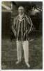 Arthur Edward Robert Gilligan. Cambridge University, Surrey, Sussex & England 1919-1932. Mono real photograph postcard of Gilligan, standing full length, wearing a striped blazer. Signed in ink to the image by Gilligan. Nias of Brighton. Good/ very good c