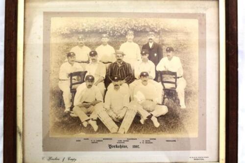 ‘Yorkshire 1897. Excellent large original sepia photograph of the Yorkshire team of 1897, standing and seated in rows, wearing blazers, Yorkshire caps and cricket attire. The photograph laid down to official photographers mount with title and players name