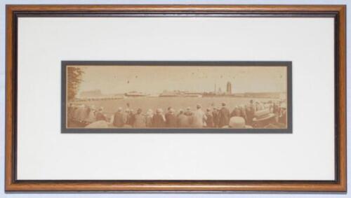 Cricket at Taunton 1910. Original small panoramic sepia photograph of a match in progress at Taunton in 1910 depicting onlookers in the foreground wearing assorted headgear, the stands and church in the background. Match unknown. The photograph, by John C