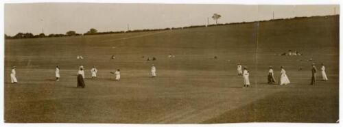 Ladies’ cricket c.1906. Original sepia press photograph of a ladies match in progress. The panoramic view of a cricket ground in an open landscape, the ladies in period attire, and a sprinkling of spectators watching on. Pencil annotation to verso describ