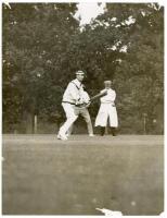 Claude Bowes-Lyon, 14th Earl of Strathmore and Kinghorne. Two original mono press photographs, one of Lord Strathmore batting, the other with team members in conversation on the pitch. Pencil annotations to verso describe ‘Lord Strathmore’s XI v Drapers o