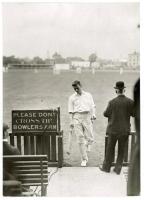 Albert Iremonger. Nottinghamshire 1906-1910. Mono postcard size press photograph of Iremonger returning to the pavilion having been dismissed. Pencil annotation to verso, ‘Notts v Surrey at Oval. Iremonger coming in’, with official press stamp for Illustr