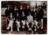 Middlesex 1910. Sepia photograph of the Middlesex team, standing and seated in rows, all wearing blazers. Title to top border and players names listed to lower border. Players include Warner (Cpt), Dougles, Baker, Weston, Saville, Hearne etc. 5.75”x4.25”.