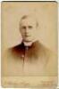 Reverend William Rashleigh. Oxford University & Kent, 1885-1901. Original sepia cabinet card photograph of Rashleigh, half length in religious cassock. Photograph by E. Hawkins of Brighton. Photographer’s name printed to lower border. Advertisement for Ha