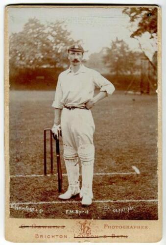 Edward Mark Sprot. Hampshire 1898-1914. Original sepia cabinet card photograph of Sprot, full length in batting attire and Hampshire cap, stood at the wicket. Name printed to lower edge of photograph. E. Hawkins & Co of Brighton. Card measures 4.25”x6.5”