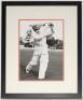 Don Bradman. Mono copy photograph of Bradman in batting pose, signed in later years to the photograph by Bradman. Approx. 12”x9”. Mounted, framed and glazed, overall 14.5”x18”. VG