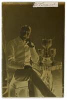 Arthur William Fitzroy Somerset. Sussex & London County 1892-1905. Original glass plate negative of a studio portrait of Somerset seated at a table on which are three trophies. The plate measures 4.25”x6.5”, with his signature in ink laid down to the top