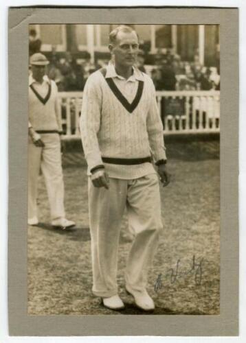 Hedley Verity. Yorkshire & England 1930-1939. Original sepia press photograph of Verity walking on to the pitch at Lord’s in the Test match v Australia, 22nd-25th June 1934, in which Verity took fifteen wickets in England’s victory by an innings and 38 ru