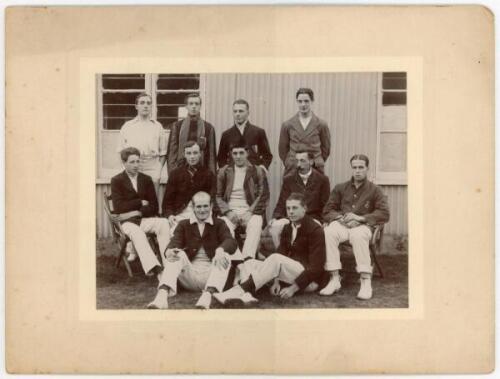 John William Henry Tyler Douglas. Essex, London County & England 1901-1928. Original mono photograph of a cricket team seated and standing in rows wearing an assortment of blazers, a corrugated pavilion in the background. J.W.H.T. Douglas is seated on the