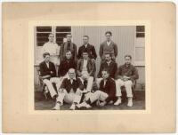 John William Henry Tyler Douglas. Essex, London County & England 1901-1928. Original mono photograph of a cricket team seated and standing in rows wearing an assortment of blazers, a corrugated pavilion in the background. J.W.H.T. Douglas is seated on the