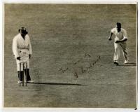 Harold Larwood. Excellent press photograph of Larwood running in to bowl for Nottinghamshire v Surrey 1935. Nicely signed in ink by Larwood ‘Yours sincerely..., very slight fading to inscription and signature. The photograph measures 10”x8”. G