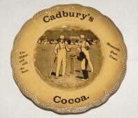 Cricket plate. ‘Cadbury’s Cocoa. The Oldest and still the best. Absolutely Pure Cocoa’. An advertising plate for Cadbury’s printed to centre with a cricket scene of a boy serving a cup of cocoa to a batsman during a game, wicketkeeper and fielders plus cr