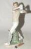 Lladro, Spain. &lsquo;Cricket Player&rsquo;. Elegant porcelain figure of a cricketer playing a flowing drive, designed by the sculptor, Regino Torrijos. Maker&rsquo;s mark to base, dated 2001, withdrawn from circulation in 2005. 17&rdquo; tall. Sadly the bat has broken at the ha