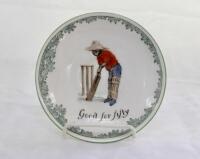 ‘Good for Fifty’ Royal Doulton Black Boy saucer, entitled ‘Good for Fifty’ printed with a boy in red shirt and a floppy hat in batting pose in front of the wicket to centre. Green floral decoration to edge. 5.5” diameter. Doulton backstamp and number ‘E43