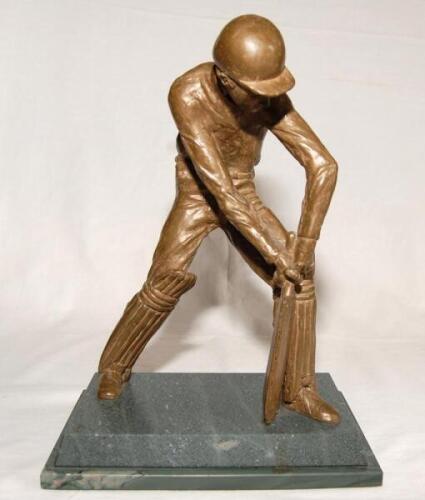 ‘Evening Standard Cricketer of the Month’. Large and heavy ‘float bronze’ sculpture of a of a batsman wearing cap in batting pose playing a forward defensive shot. The figure mounted on a marble plinth. The figure stands 10.5 tall. Similar trophies were a