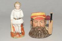 W.G. Grace. Royal Doulton ceramic caricature toby jug of ‘The Champion’ W.G. Grace 1989. D6845. 4” tall. Limited edition no 6092/9500. G. Sold with an original Staffordshire 19th century pottery figure of a child holding a cricket bat to side, wearing a w