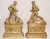 A pair of unusual Victorian brass sporting fire dogs/andiron figures. One depicts a footballer kicking a ball, the other a rugby player running with the ball, both players wearing caps. The figures stand on fireplaces each of which is decorated to centre 