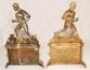 A pair of unusual Victorian brass sporting fire dogs/andiron figures. One depicts a footballer kicking a ball, the other a rugby player running with the ball, both players wearing caps. The figures stand on fireplaces each of which is decorated to centre - 2