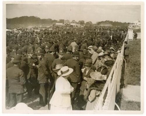 Epsom Derby 1921. Original mono press photograph depicting a very large contingent of uniformed police officers amongst the packed crowds present at the 1921 Derby. Press caption to verso describes ‘A ‘few’ of the police necessary to maintain crowd order 