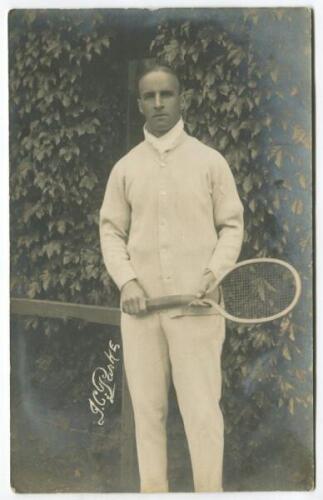 James Cecil Parke. Rare original sepia real photograph postcard of Parke, standing full length, wearing tennis attire and holding a racket in front of the ivy clad entrance to centre court circa 1912. Players name printed to lower border. Postcard by Edwi