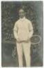 James Cecil Parke. Rare original sepia real photograph postcard of Parke, standing full length, wearing tennis attire and holding a racket in front of the ivy clad entrance to centre court circa 1912. Players name printed to lower border. Postcard by Edwi