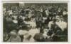 ‘Wimbledon 1914’. Rare original mono real photograph postcard showing the many spectators enjoying lunch outdoors, long table clothed tables with waitresses serving, ladies in hats and men in boaters etc. Card no. 034 in a series issued by Edwin Trim & Co