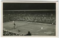 ‘Wimbledon Centre Court’ circa early 1930’s. Original mono action real photograph postcard with a ladies singles match in progress. Card no. S73 in a series issued by Edwin Trim & Co. of Wimbledon, publishers name printed to lower corner. Postally unused.