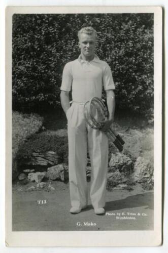 Constantine ‘Gene’ Mako. Original mono real photograph postcard of Mako, standing full length, wearing tennis attire and holding two rackets to his side. Players name printed to lower border. Card no. T13 in a series issued by Edwin Trim & Co. of Wimbledo