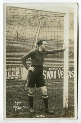 Herbert Edwin Blake. Tottenham Hotspur 1921-1923. Mono real photograph postcard of goalkeeper Blake, full length, in Spurs attire leaning on the goal post. Title ‘Blake’ to lower border. W.J. Crawford of Edmonton postcard. Good/very good condition Postal