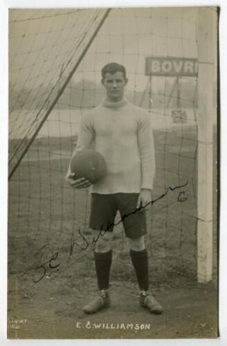 Ernest Clarke Williamson. Tottenham Hotspur 1916-17. Mono real photograph postcard of goalkeeper Williamson, full length, in jersey with football in left hand standing next to the goal. Title ‘E.C. Williamson’ to lower border. Nicely signed in ink by Will