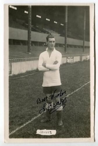 James Andrew Banks. Tottenham Hotspur 1913-1923. Mono real photograph postcard of Thompson, full length, wearing Spurs attire in front of the main stand. Very nicely signed in ink by Thompson. Name printed to lower border. W.J. Crawford of Edmonton postca