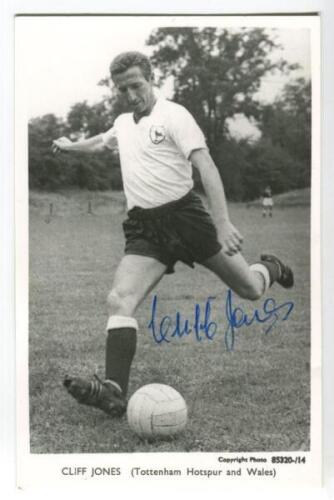 Clifford William Jones. Tottenham Hotspur 1958-1968. Mono plain backed real photograph postcard of Jones, full length in Spurs attire, about to kick the ball. Signed by Jones to image. Printed title to lower border. Good condition