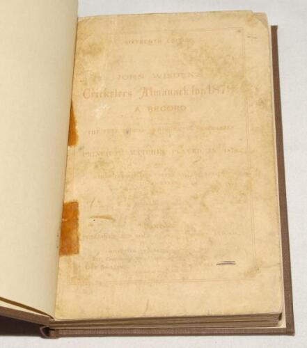 Wisden Cricketers’ Almanack 1879. 16th edition. Original paper wrappers, bound in dark brown boards, with gilt titles to spine. Some fading and wear to wrappers, some rounding and small loss to corners, some small tape marks near to spine on front and rea