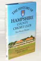 ‘The History of Hampshire County Cricket Club’. Peter Wynne-Thomas. Christopher Helm, Bromley 1988. Hardback with dustwrapper. Over one hundred and eighty signatures in total to the front and rear endpapers, title pages and the odd internal page. The majo