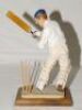 ‘The Cricketer’. Large stone ware resin figure of a batsman, thought to be of F.S. Jackson, wearing navy blue cap playing a shot with wooden stumps to plinth. - 2