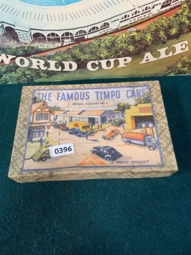 Timpo Product "The Famous Timpo Cars" Petrol Station No.1 Containing 2 X Vehicles, 2 X Figures And 3 X Petrol Pumps - Conditions Are Generally Good To Good Plus Still Lovely Bright Examples In A Generally Good Colourful Lift Off Lid Box. (Ref PA396)