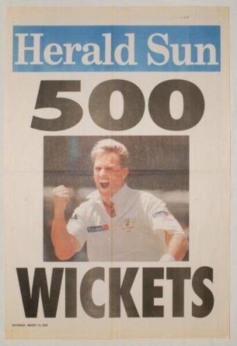 Shane Warne and Dennis Lillee. Two original colour newspaper posters celebrating Shane Warne’s significant achievements. One copy with headline ‘500 Wickets’, Herald Sun, 13th March 2004 and the other with headline ‘Warne’s Magic Milestone’, Sydney Mornin