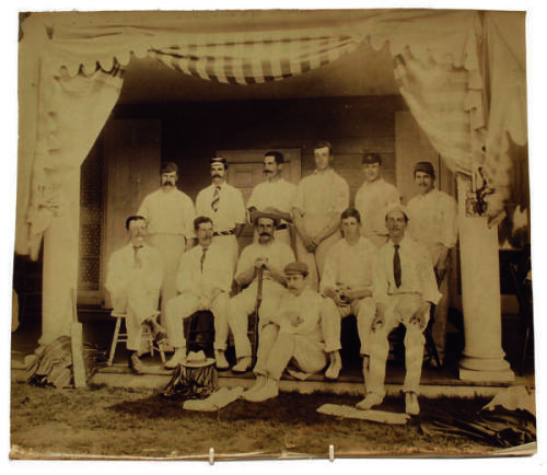 Lord Hawke’s tour of the United States and Canada 1891. Good, large, original and attractive photograph of the touring team, seated and standing in front of a pavilion on the tour. The photograph, with illegible name of photographer to corner, shows Hawke