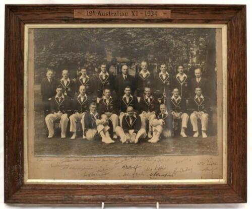 Australia tour of England 1934. Original mono photograph of the Australian team who toured England in 1934, seated and standing in rows, wearing cricket attire and all dressed in their touring blazers. The photograph, by Sasha of Pall Mall, London, is lai