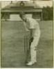 Wilfred Walter Timms. Northamptonshire 1921-1932. Excellent large original photograph of a youthful Timms, wearing cap and in batting stance in front of the wicket with pavilion to background. Signed to image in biro, in later years by Timms, and dated Ju