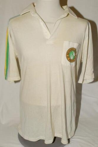 Robert Graeme Pollock, Eastern Province, Transvaal & South Africa 1961-1983. White ‘Benson & Hedges Series’ cricket shirt worn by Pollock in the mid 1980s matches for Transvaal. The shirt with multi colours band to shoulders and ‘Benson & Hedges Series’ s